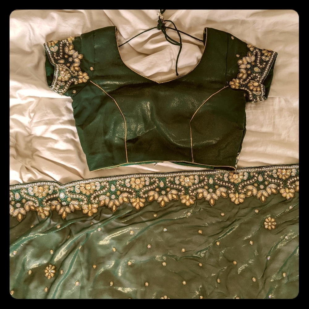 Used evergreen and gold saree
